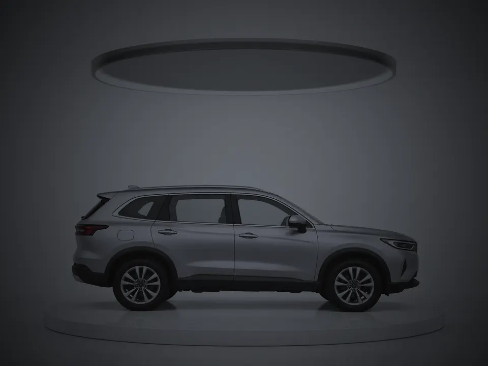 The usual way: a silver SUV in a dark studio with the lights off